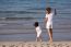 Asian Mom And Son On Beach