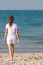 Asian Woman Walking On Beach