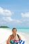 Beautiful Senior Woman Walking On A Tropical Beach