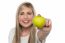 Smiling Girl Displaying Fresh Green Apple To The Camera