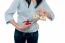 Woman Cutting Ten Dollar Banknote With Scissors