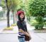 Sweet Young Woman Standing Outdoors And Smiling In Public Park