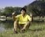 Senior Man With Thumb Up Against A Green Park