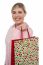 Cheerful Blonde Girl Holding Shopping Bag