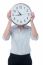 Woman Hiding Her Face Behind Wall Clock