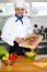 Chef Putting Vegetables In A Bowl