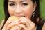 Girl Eating A Cheeseburger