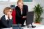 Two Cheerful Corporate Women In Office