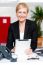 Businesswoman With Tablet Pc At Her Desk