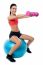 Woman In Gym Working Out With Dumbbells