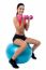 Fit Woman In Gym Working Out With Dumbbells