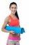 Woman Gym Instructor Holding Blue Mat