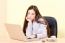 Woman Working On Computer In Office