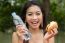 Young Woman Enjoying A Chicken Burger