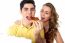 Young Couple Sharing A Pizza Slice