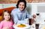 Little Girl With Her Father At A Restaurant