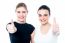 Two Girls Cheering Via With Thumbs Up Gesture