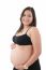 Hispanic Pregnant Woman Smiling And Touching Her Belly