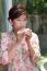 Young Woman Drinking Beverage From White Ceramic Cup