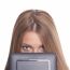 Beautiful Woman Hiding Face With Tablet Computer