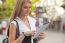 Woman With Ipad Tablet Computer Walking On Urban Street