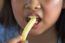 Asian Girl Eating French Fries