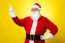 Cheerful Santa Pointing Away. Copy Space Concept