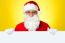 Male Santa Standing Behind Big Blank Banner Ad Board