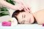 Woman On Ear Massage In Salon