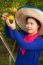 Gardener Girl In Orange Garden, North Of  Thailand