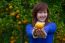 Gardener Girl Picking Fresh Orange