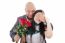 Man Offering A Bouquet Of Red Roses To A Woman