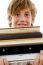 Book Pile With Student Holding Books