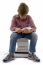 Front View Of Boy Sitting On Books On White Background