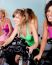 Female Cycling In Fitness Club