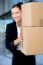 Female Executive Holding Cardboard Boxes