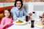 Little Girl With Her Father At A Restaurant