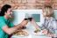 Couple Toasting Over A Restaurant Table