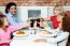 Family Raising Their Glasses Before Eating