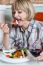 Woman Relishing Her Meal With Red Wine