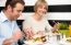 Couple Enjoying Delicious Breakfast