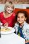 Mother And Daughter In A Restaurant