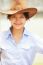 Asian Woman Wearing Cowboy Hat And Smiling