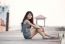 Beautiful Asian Woman Sitting On Wood Pier With Relaxing Emotion