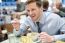 Smiling Young Businessman Having Lunch