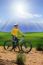 Young Man Standing Beside Moutain Bike ,mtb On Hill With Sun Shi