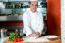 Smiling Chef Preparing Pizza Base