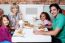 Family Eating Together In A Restaurant