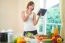 Young Woman Reads Cookbook