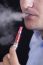 Men Smoke An Electronic Cigarette